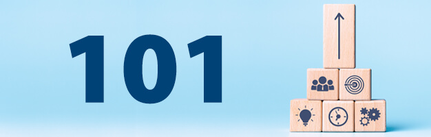 Number 101 on light blue background next to stack of wood building blocks