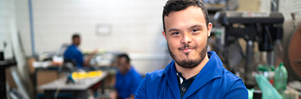 smiling special needs employee in industry