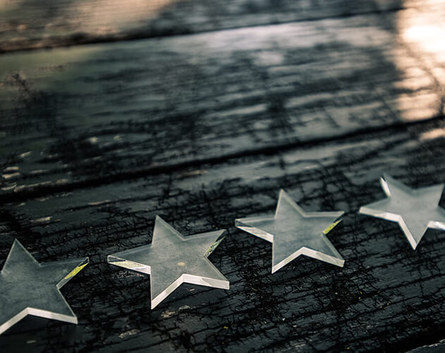 Five stars on wood background