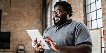 Business man using digital tablet in an office