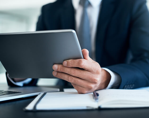 Businessman using a tablet at his desk