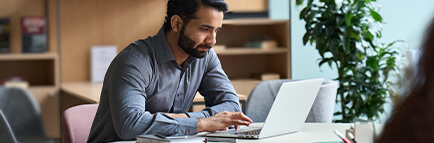 Young businessman working on laptop