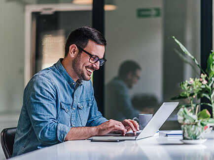 Man working at a laptop computer