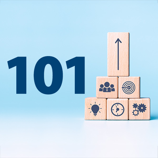 Number 101 on light blue background next to stack of wood building blocks